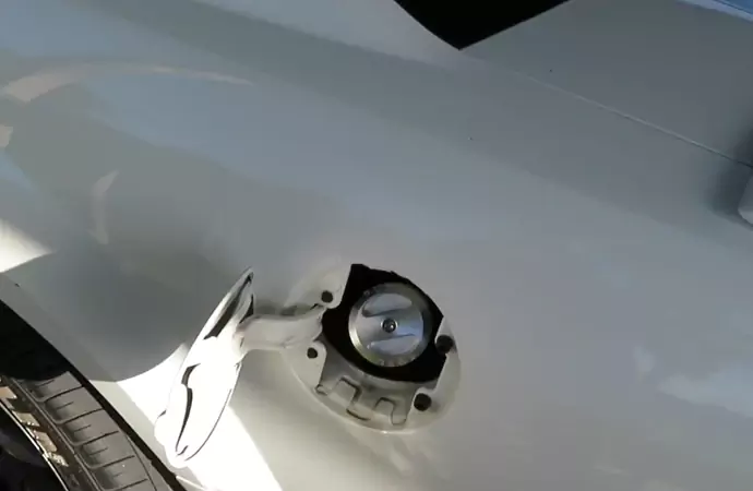 Why do fuel caps have partial venting?